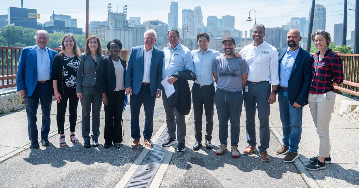 Gov. Tim Walz, Minneapolis Mayor Jacob Frey, Park Board Commissioner Becka Thompson, and other dignitaries at the Stone Arch Bridge reopening ceremony in Minneapolis, July 21, 2025.